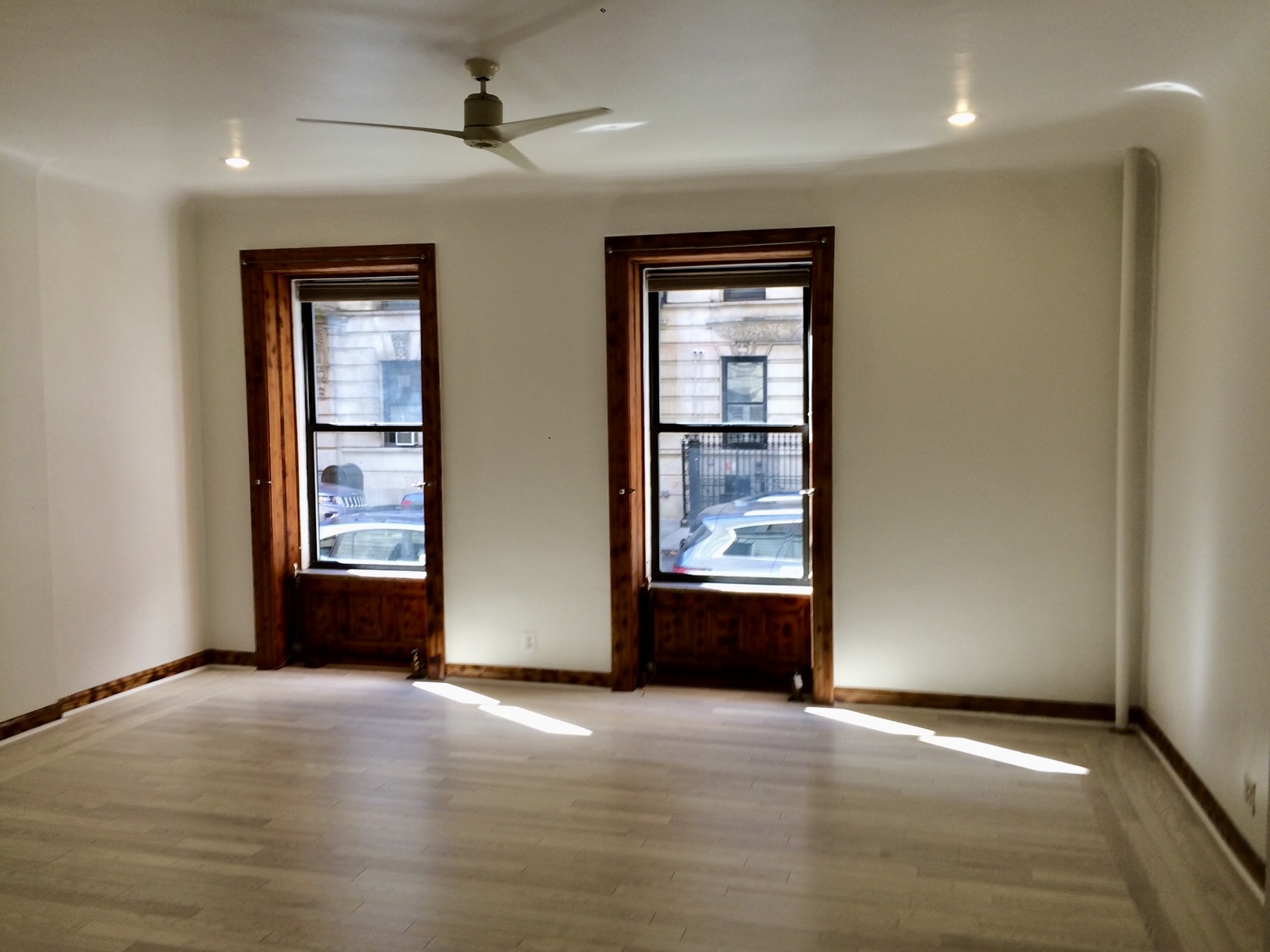 323 West 83rd Street, Unit 1C Manhattan, NY 10024 - Photo 2 of 8 an empty room with windows and closet