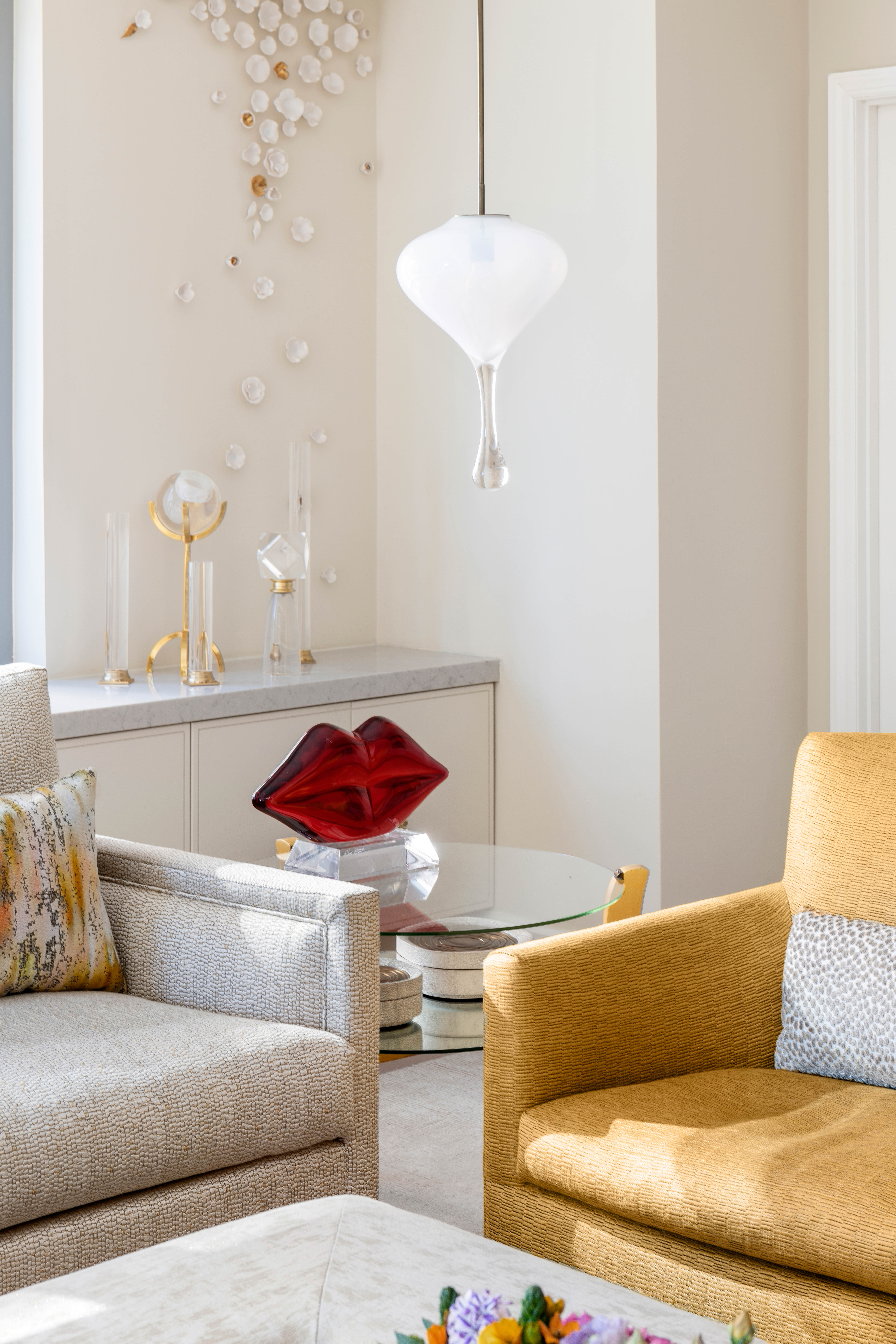 200 East 62nd Street, Unit 5A Manhattan, NY 10065 - Photo 17 of 25 a living room with a couch and a chandelier