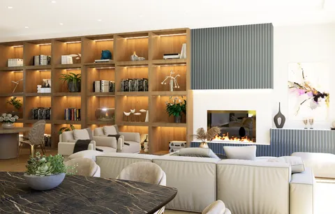 a living room with furniture a fireplace and a potted plant