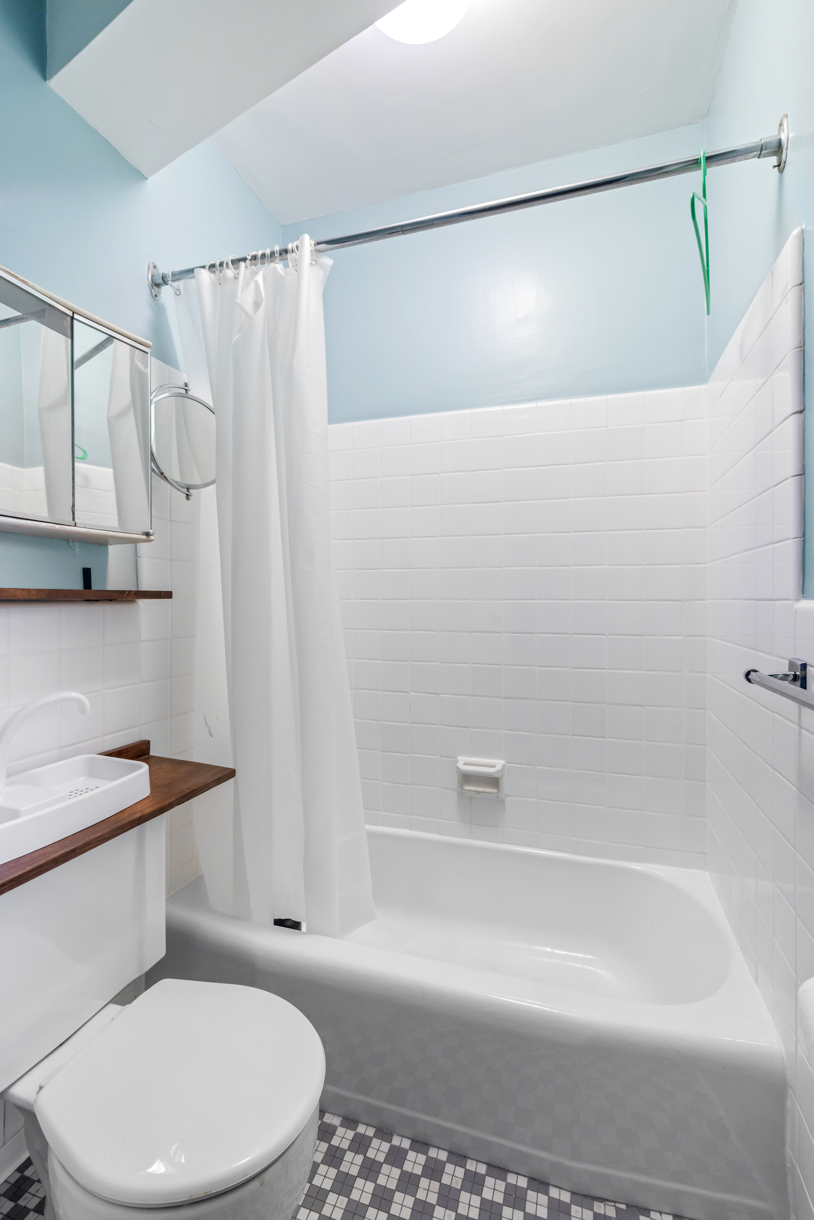 16 Sutton Place, Unit 11A Manhattan, NY 10022 - Photo 13 of 19 a bathroom with a toilet and a shower