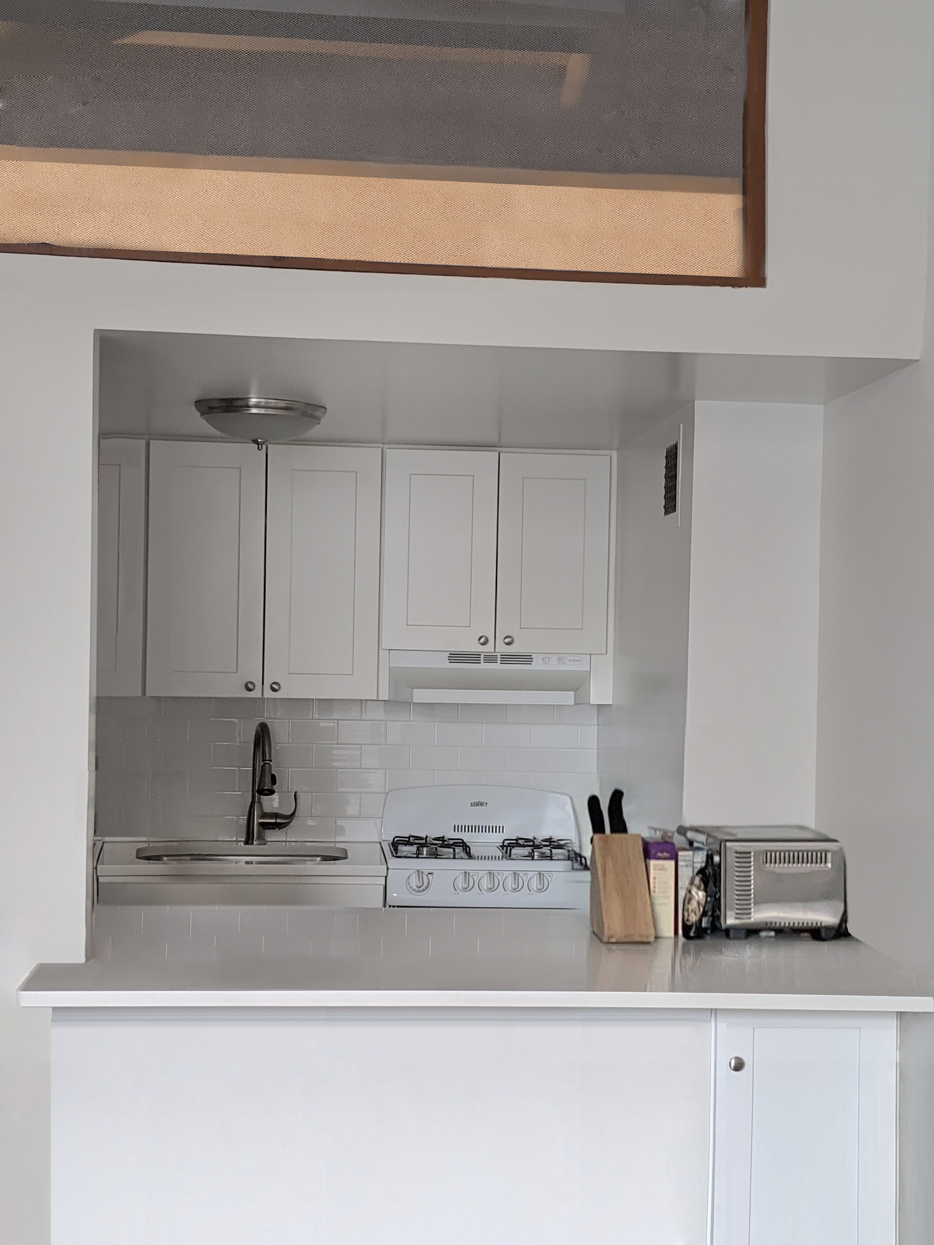 350 East 62nd Street, Unit 4D Manhattan, NY 10065 - Photo 2 of 3 a kitchen with a sink and cabinets