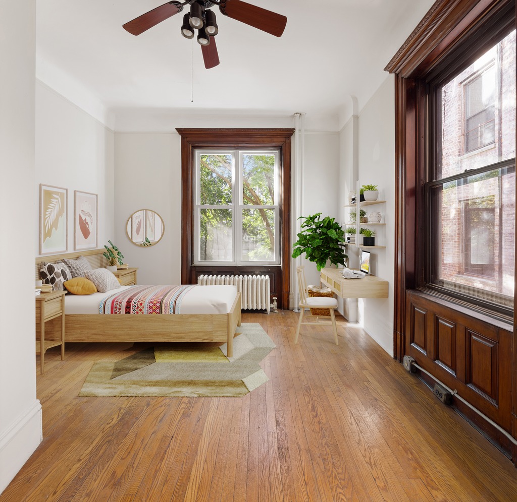 614 West 146th Street, Unit 4FAM Manhattan, NY 10031 - Photo 12 of 18 a living room with furniture and a large window