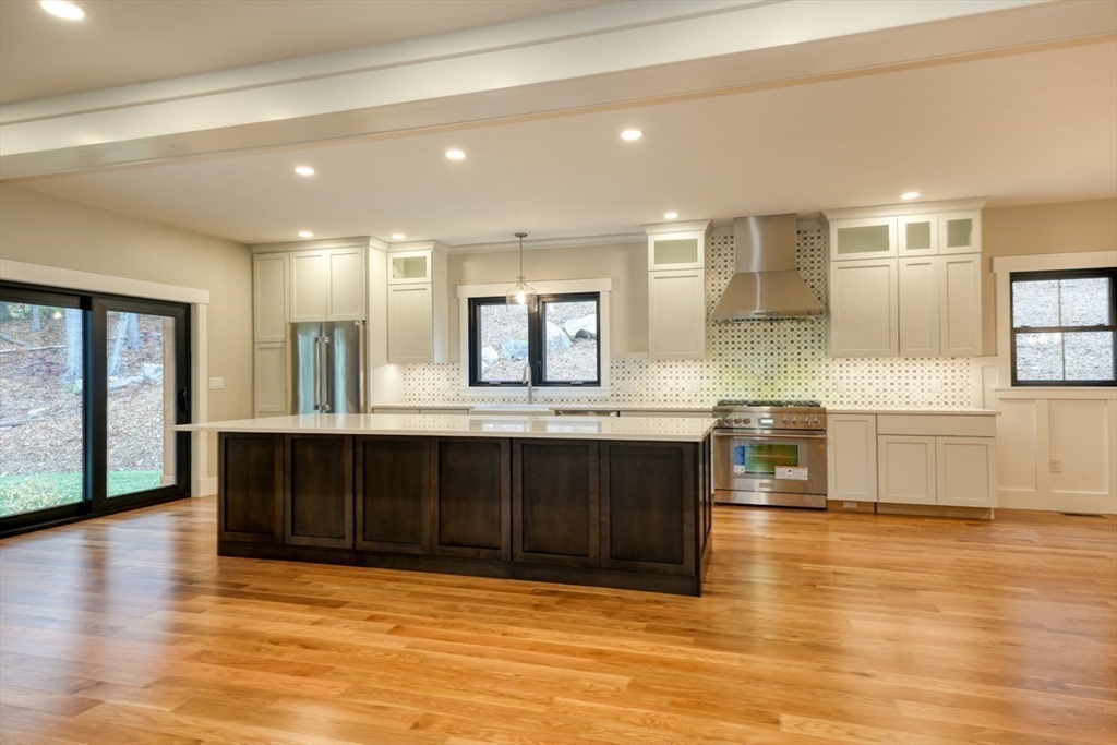 171 Randall Road Berlin, MA 01503 - Photo 8 of 41 a kitchen with stainless steel appliances granite countertop a stove and a sink