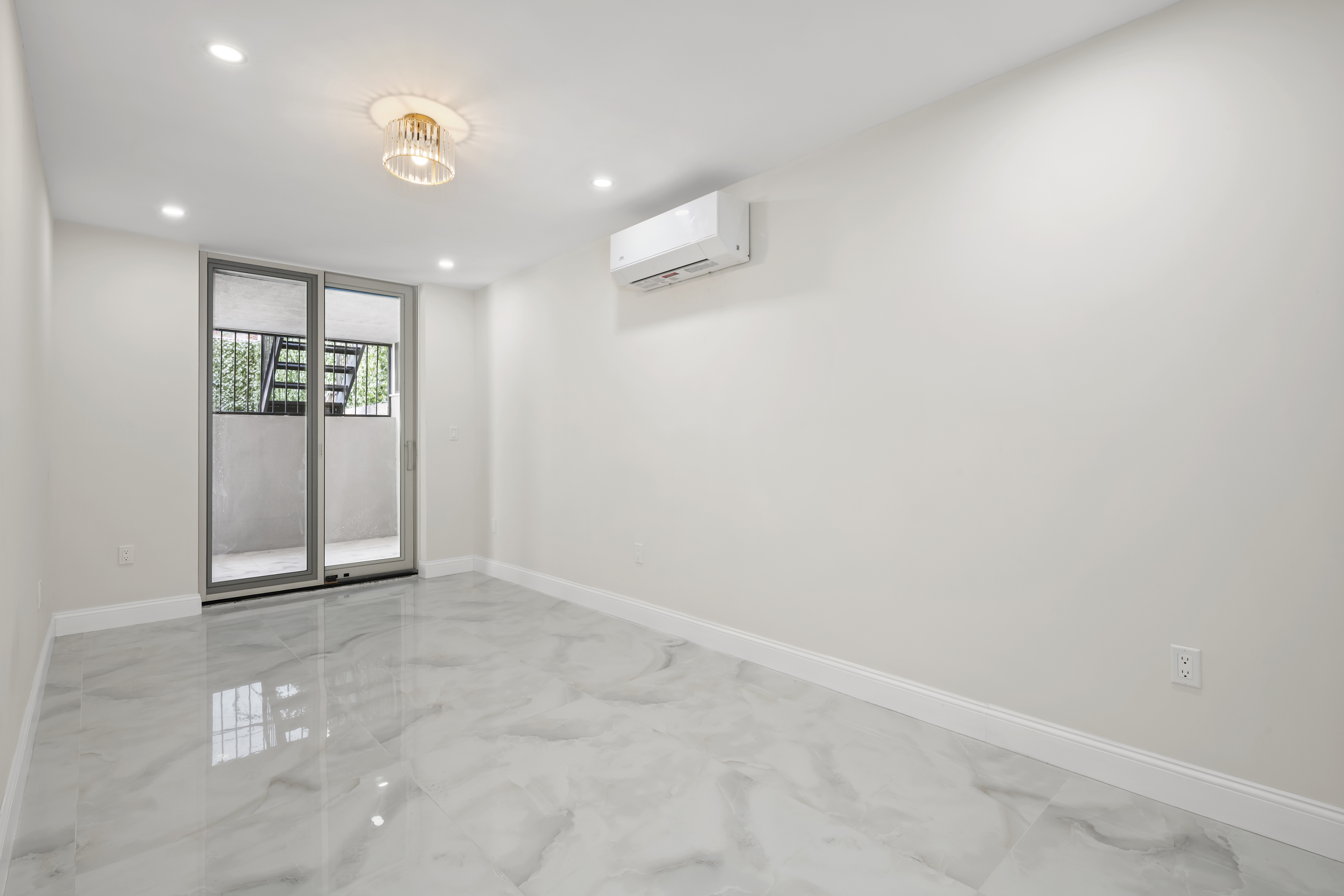 84 Himrod Street Brooklyn, NY 11221 - Photo 32 of 35 a view of a livingroom with wooden floor and a window