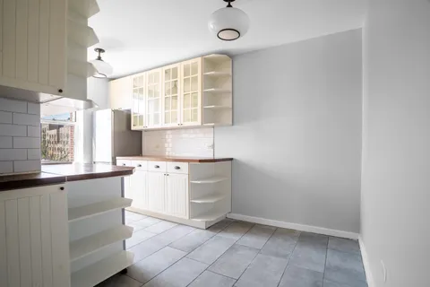 a kitchen with a cabinets and window