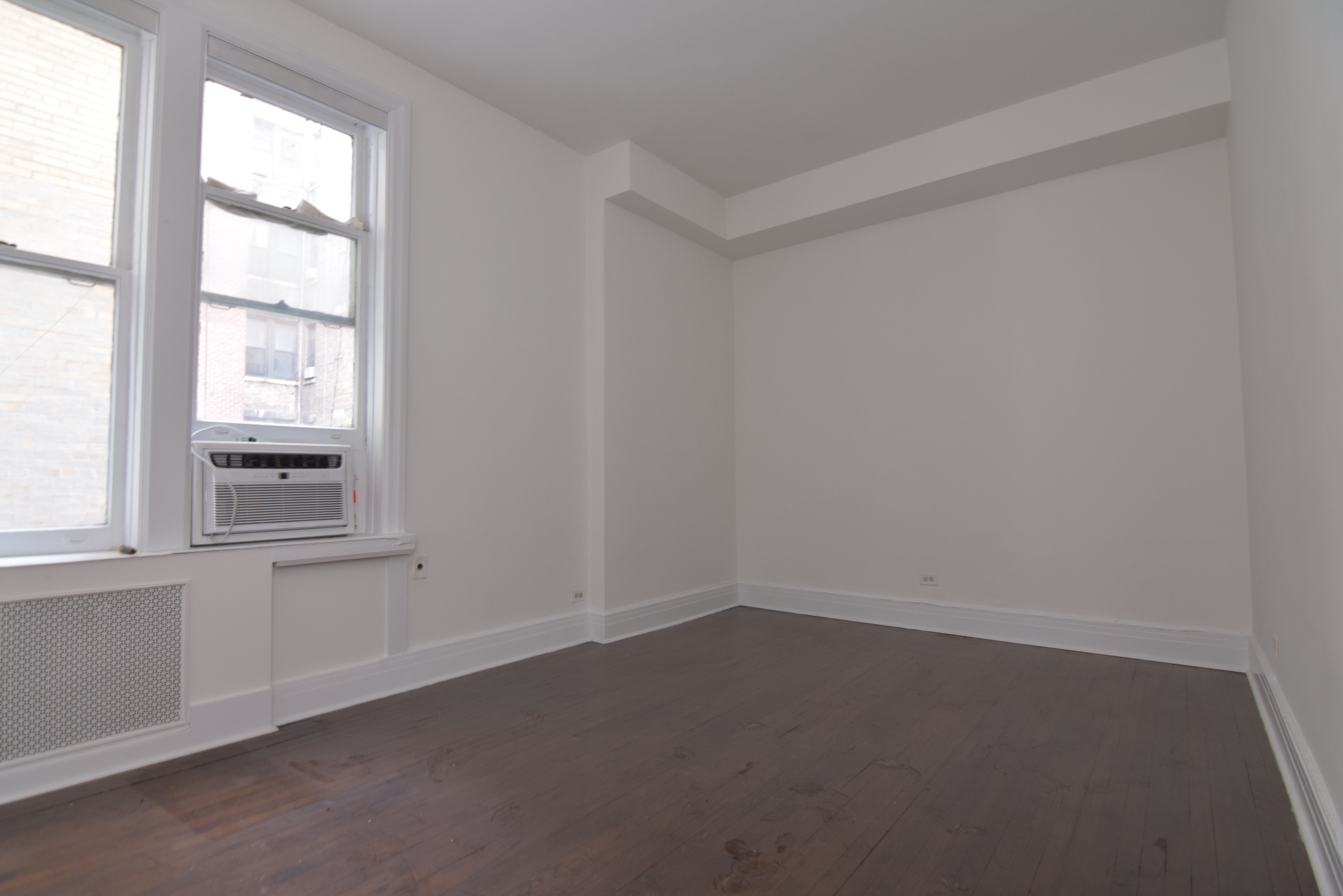 18 East 67th Street, Unit 2B/3B Manhattan, NY 10065 - Photo 10 of 18 an empty room with a window