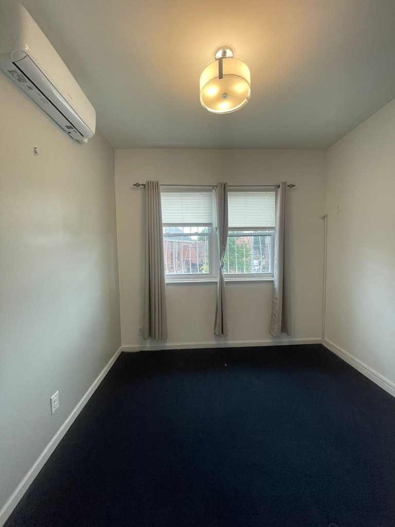 88-13 Corona Avenue, Unit 2 Queens, NY 11373 - Photo 6 of 7 a view of an empty room with a window