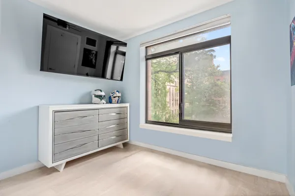 a room with furniture and a flat screen tv