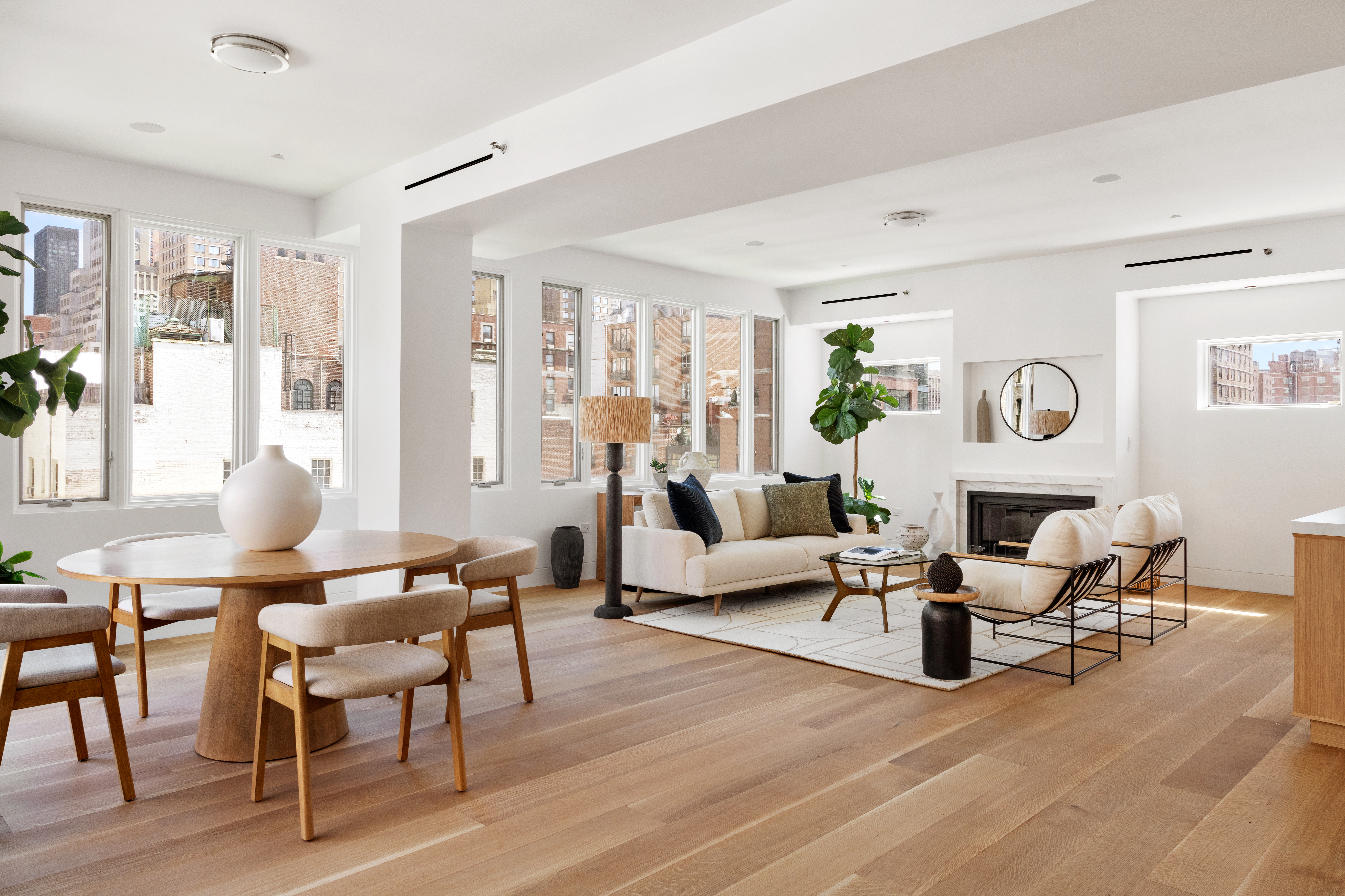 120 East 29th Street, Unit PHB Manhattan, NY 10016 - Photo 2 of 10 a living room with furniture dining area and a window