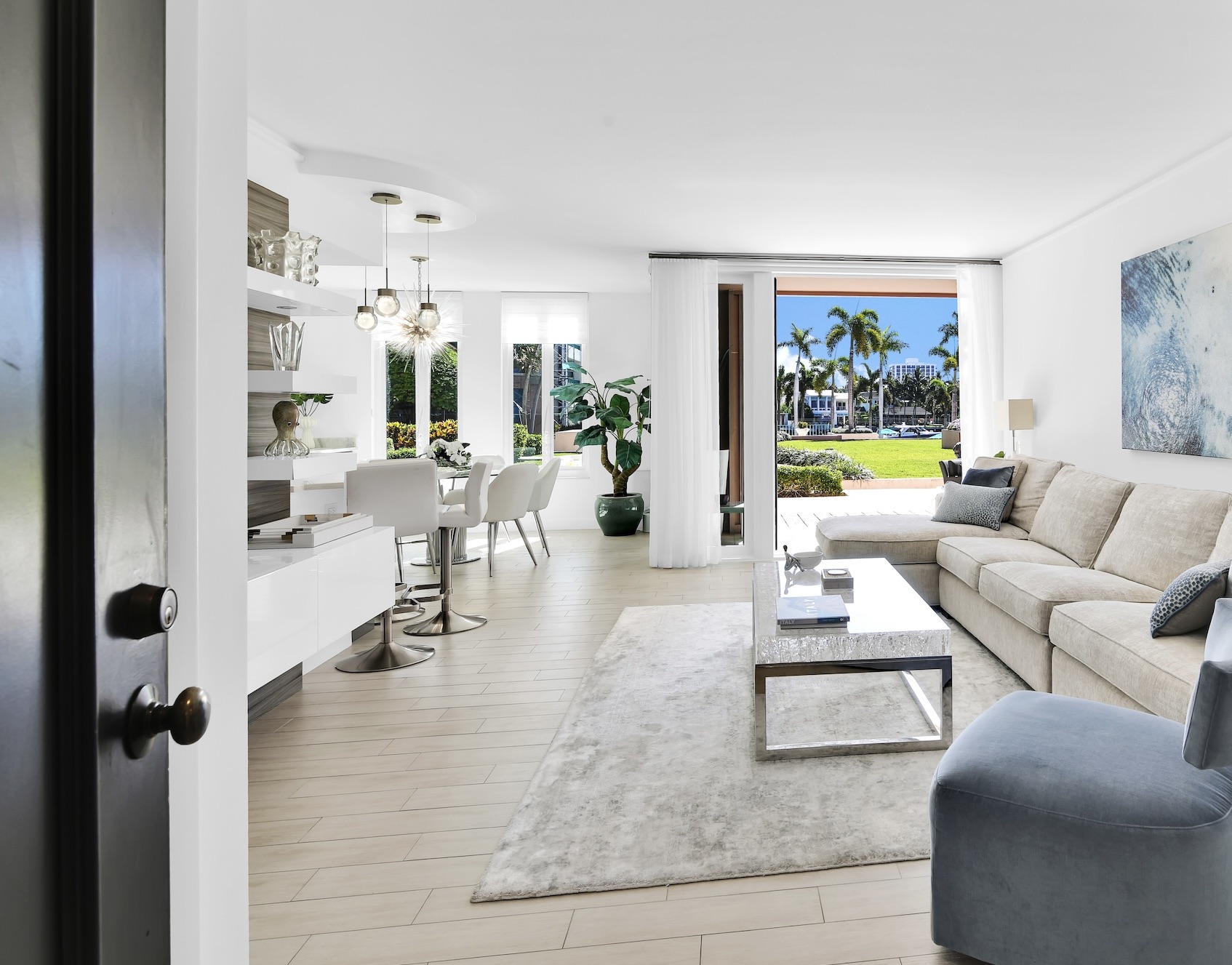 a living room with furniture and a large window