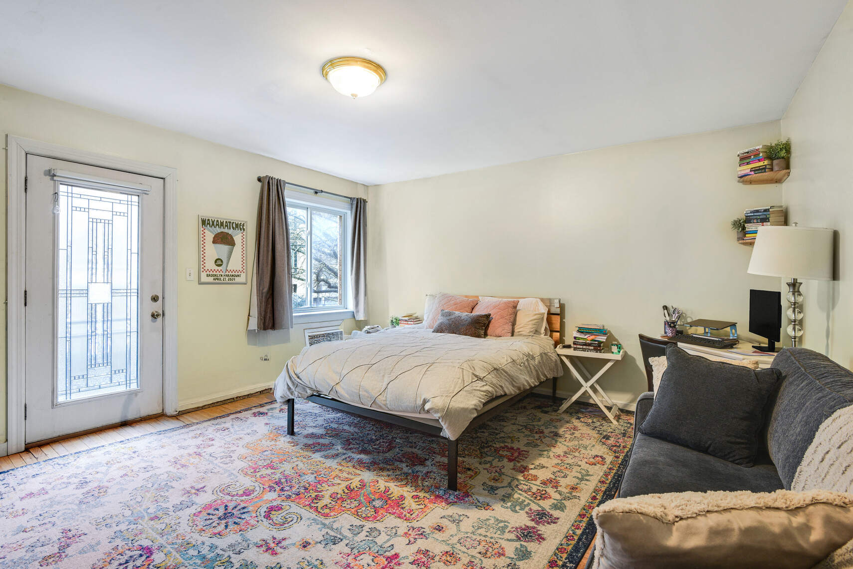 585 Warren Street, Unit 2 Brooklyn, NY 11217 - Photo 4 of 12 a bedroom with a bed couch and a window