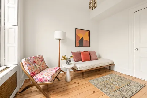 a living room with furniture and a rug