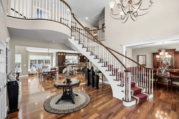 a view of entryway dining room and hall with wooden floor
