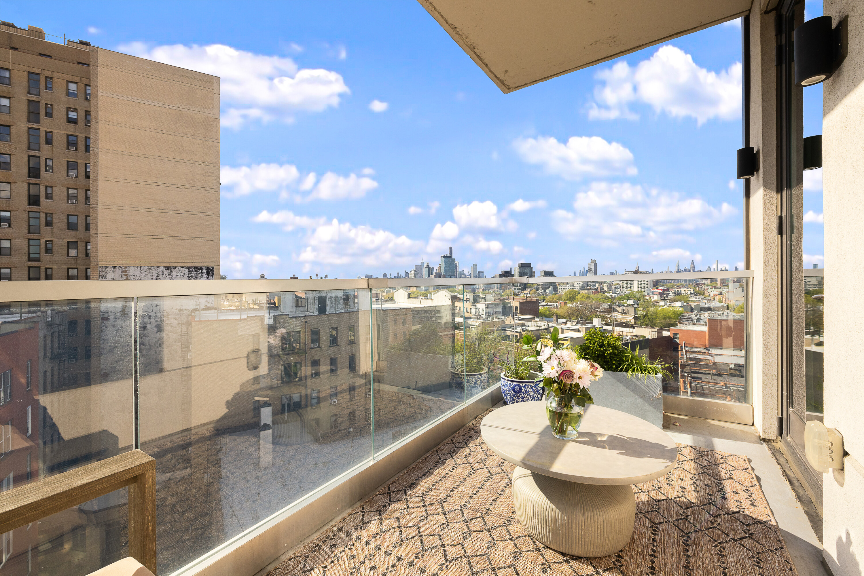 856 Washington Avenue, Unit 9A Brooklyn, NY 11238 - Photo 5 of 25 a view of a balcony with dining table and chairs