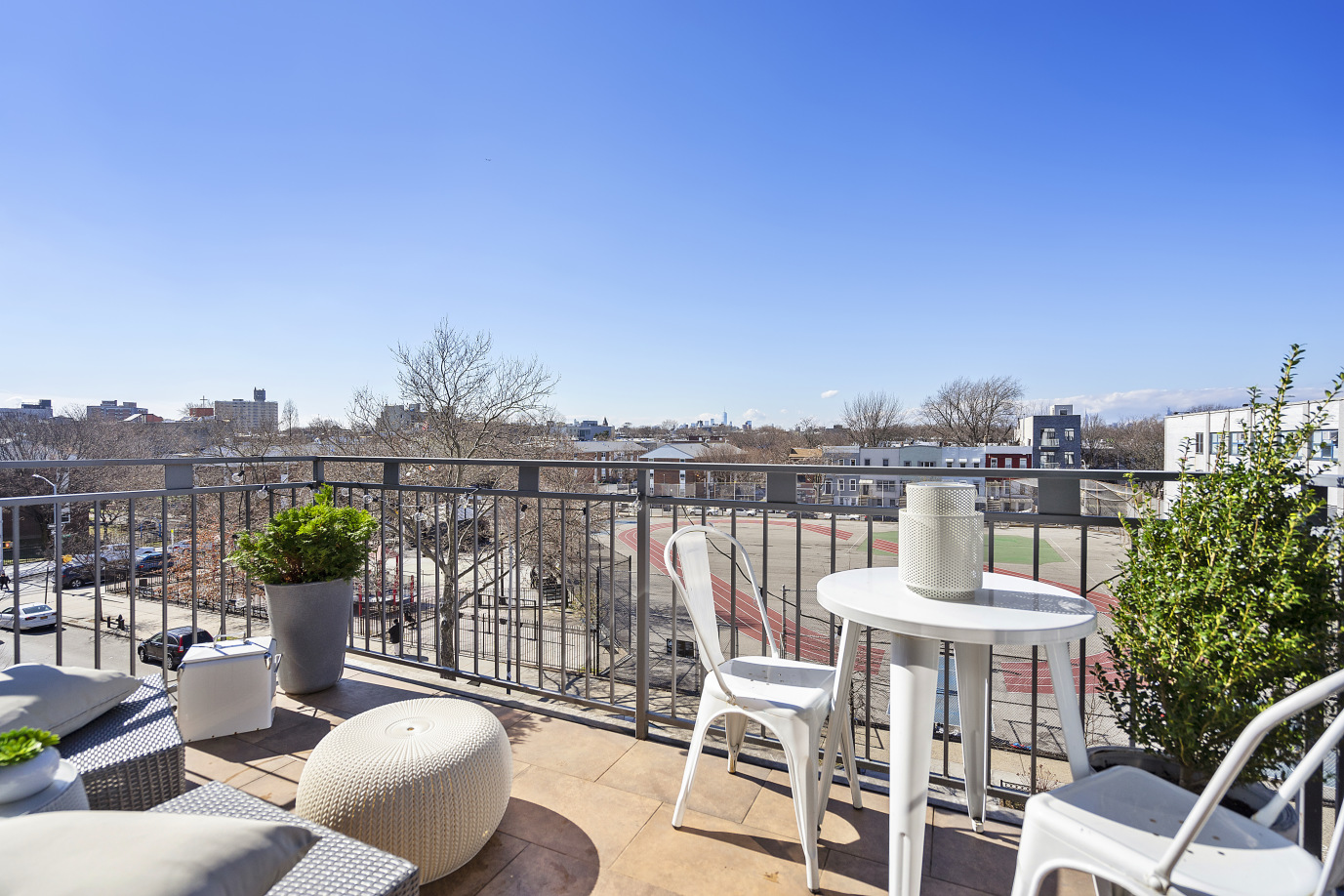 116 Covert Street, Unit 4A Brooklyn, NY 11207 - Photo 6 of 7 a view of a balcony with two chairs and a table