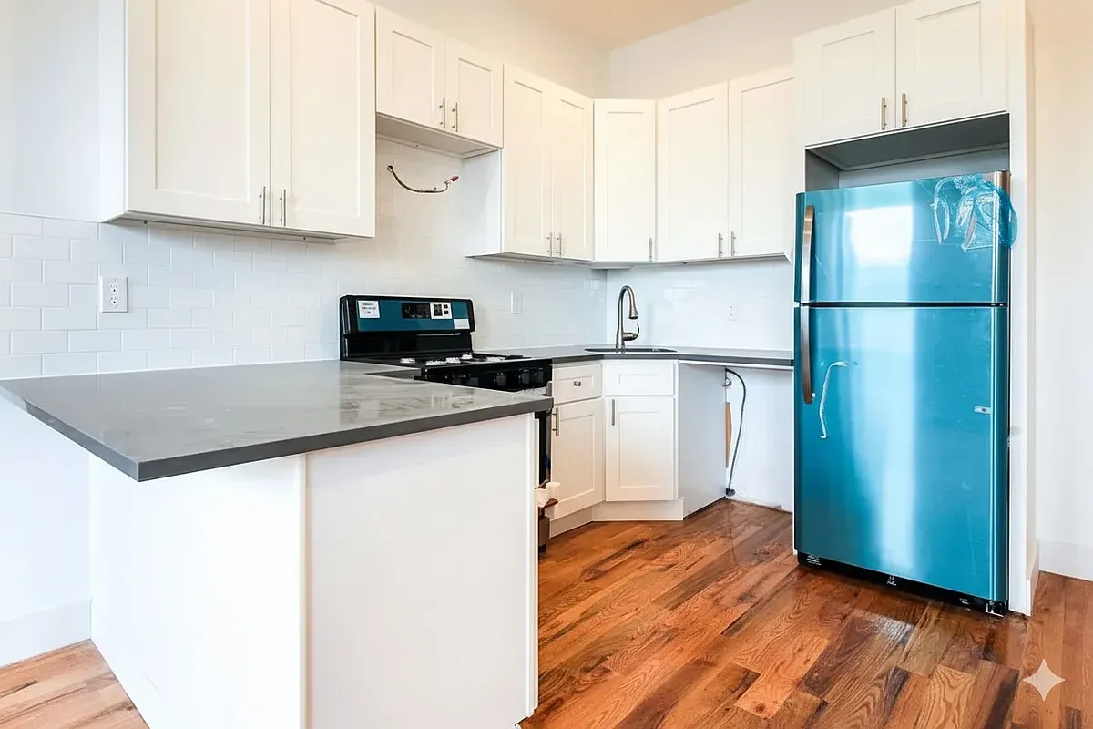 a kitchen with stainless steel appliances granite countertop a refrigerator sink and cabinets