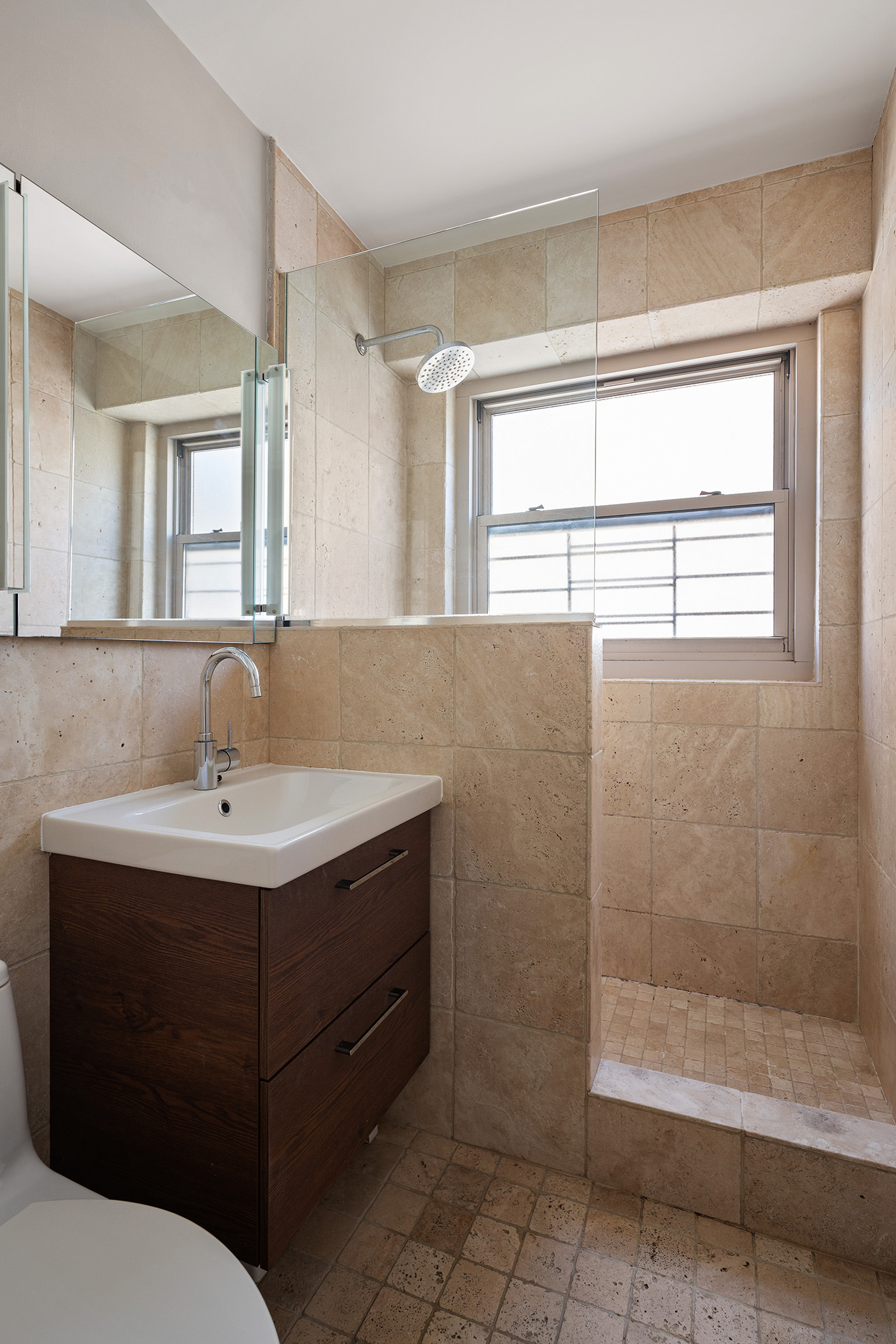 137 East 36th Street, Unit 24C Manhattan, NY 10016 - Photo 4 of 12 a bathroom with a sink and a mirror