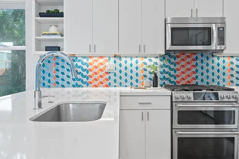 a kitchen with a stove microwave and cabinets