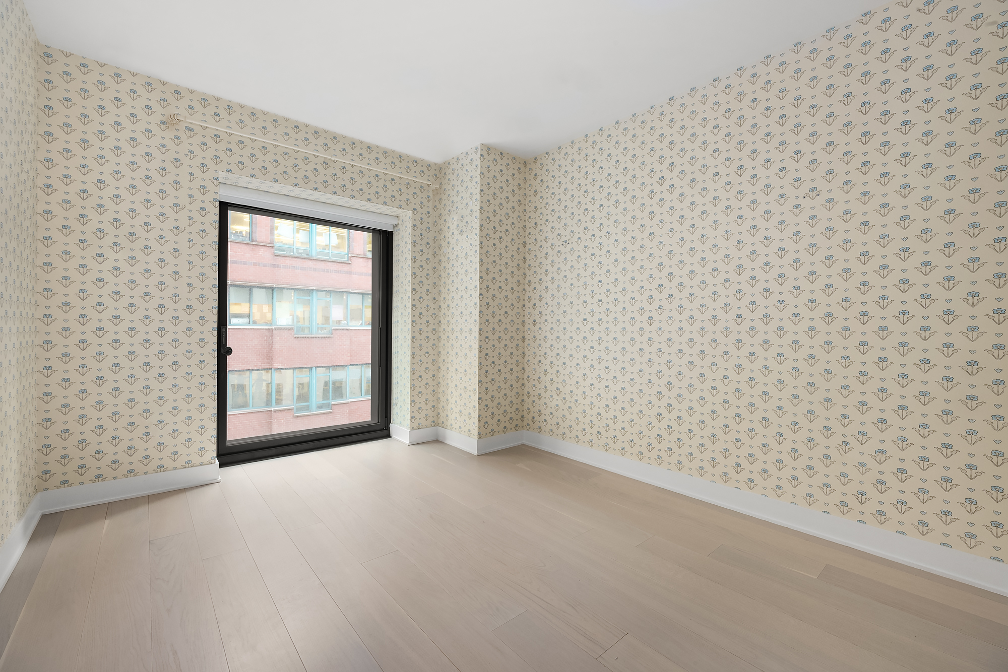 55 West 17th Street, Unit 603 Manhattan, NY 10011 - Photo 7 of 9 a view of an empty room with a window