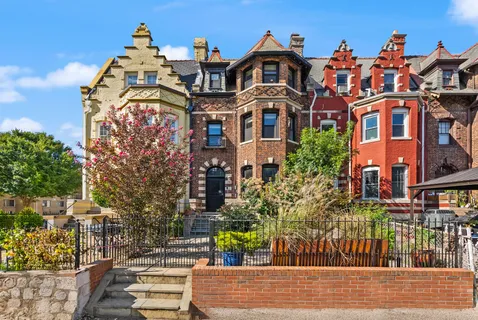 a view of a chair and table in front of house