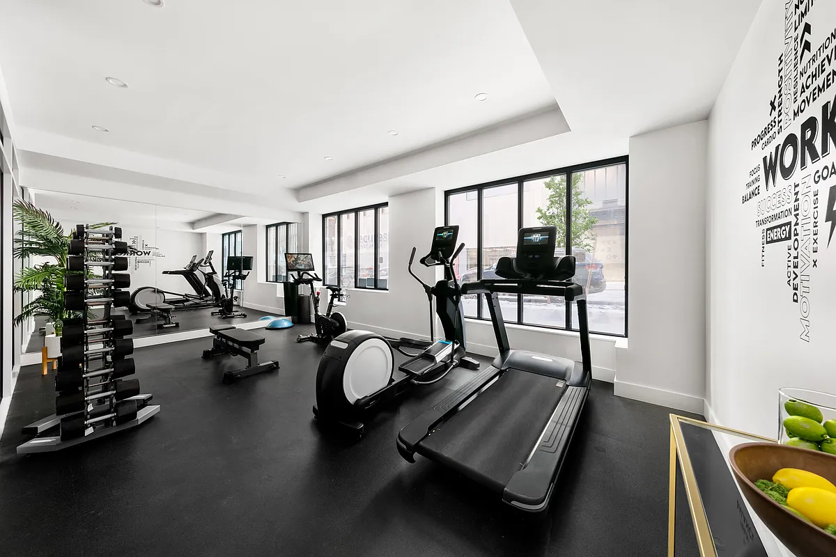 427 East 90th Street, Unit 5A Manhattan, NY 10128 - Photo 11 of 13 a view of a room with gym equipment