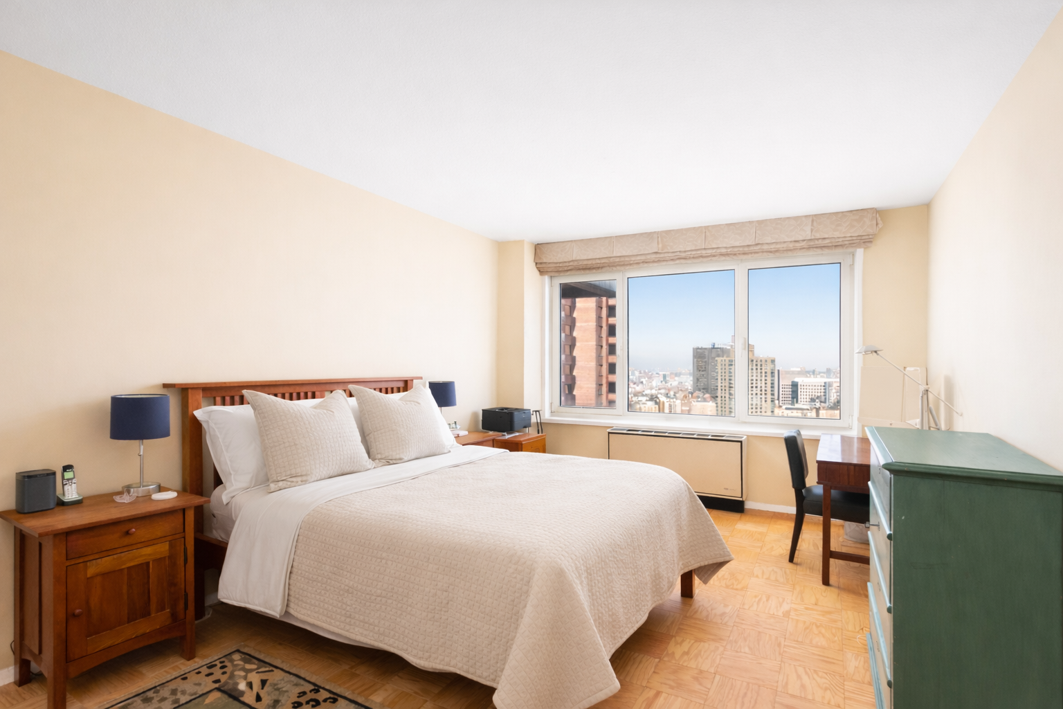 50 East 89th Street, Unit 31C Manhattan, NY 10128 - Photo 8 of 18 a bed room with a bed and a table