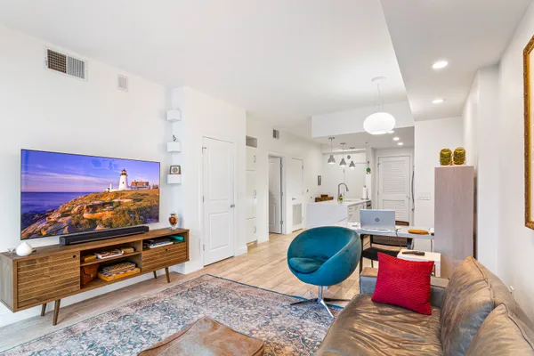 a living room with furniture and a rug