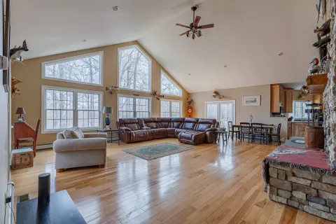 a kitchen with stainless steel appliances granite countertop a refrigerator a stove and a sink with cabinets