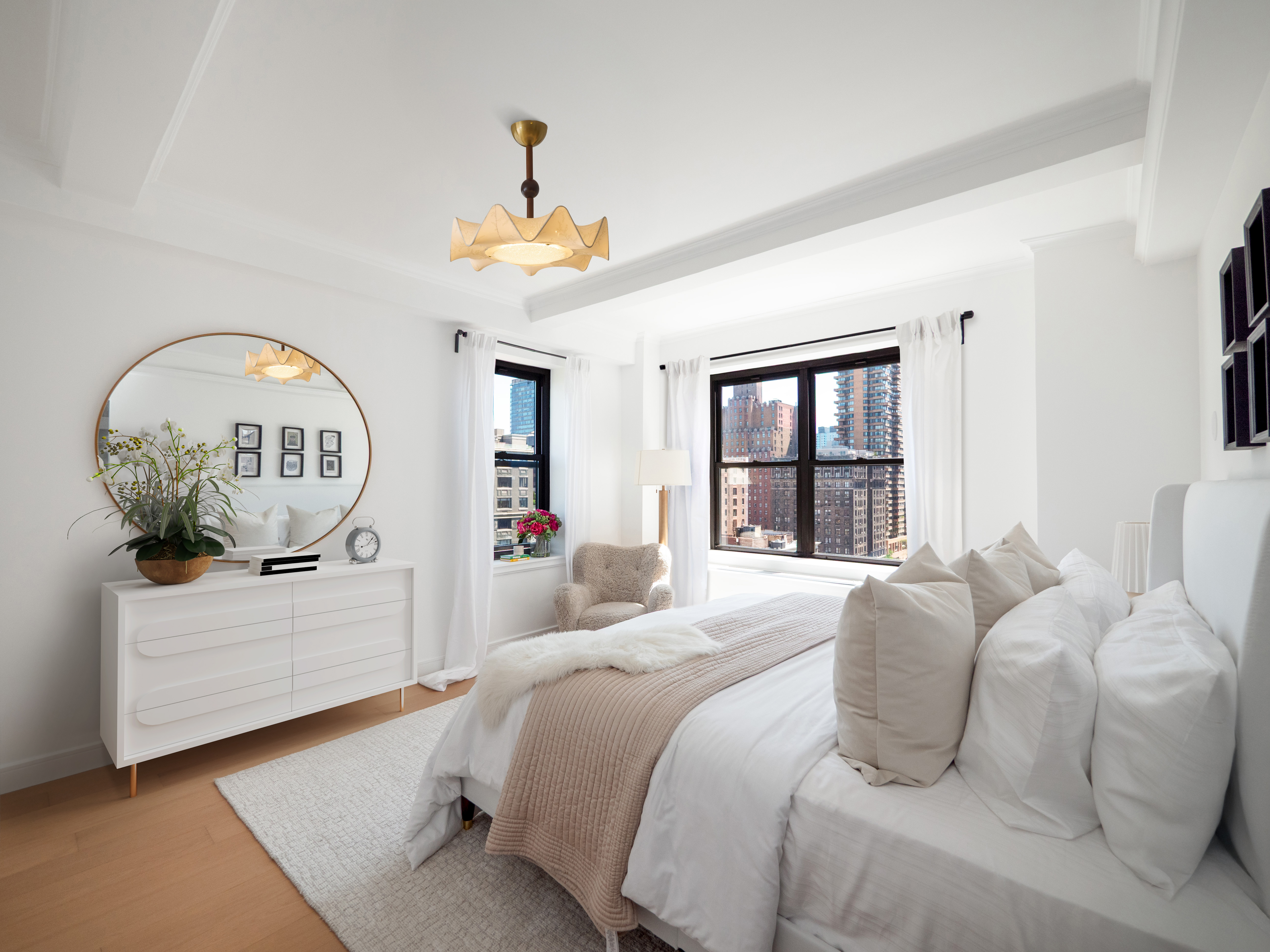 230 Riverside Drive, Unit 14AC Manhattan, NY 10025 - Photo 12 of 30 a bedroom with a bed and a large window