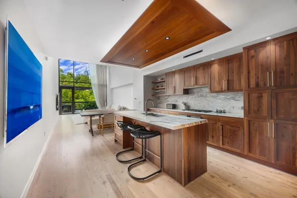a kitchen with a stove a sink and a refrigerator