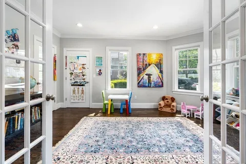 a bedroom with furniture and a window