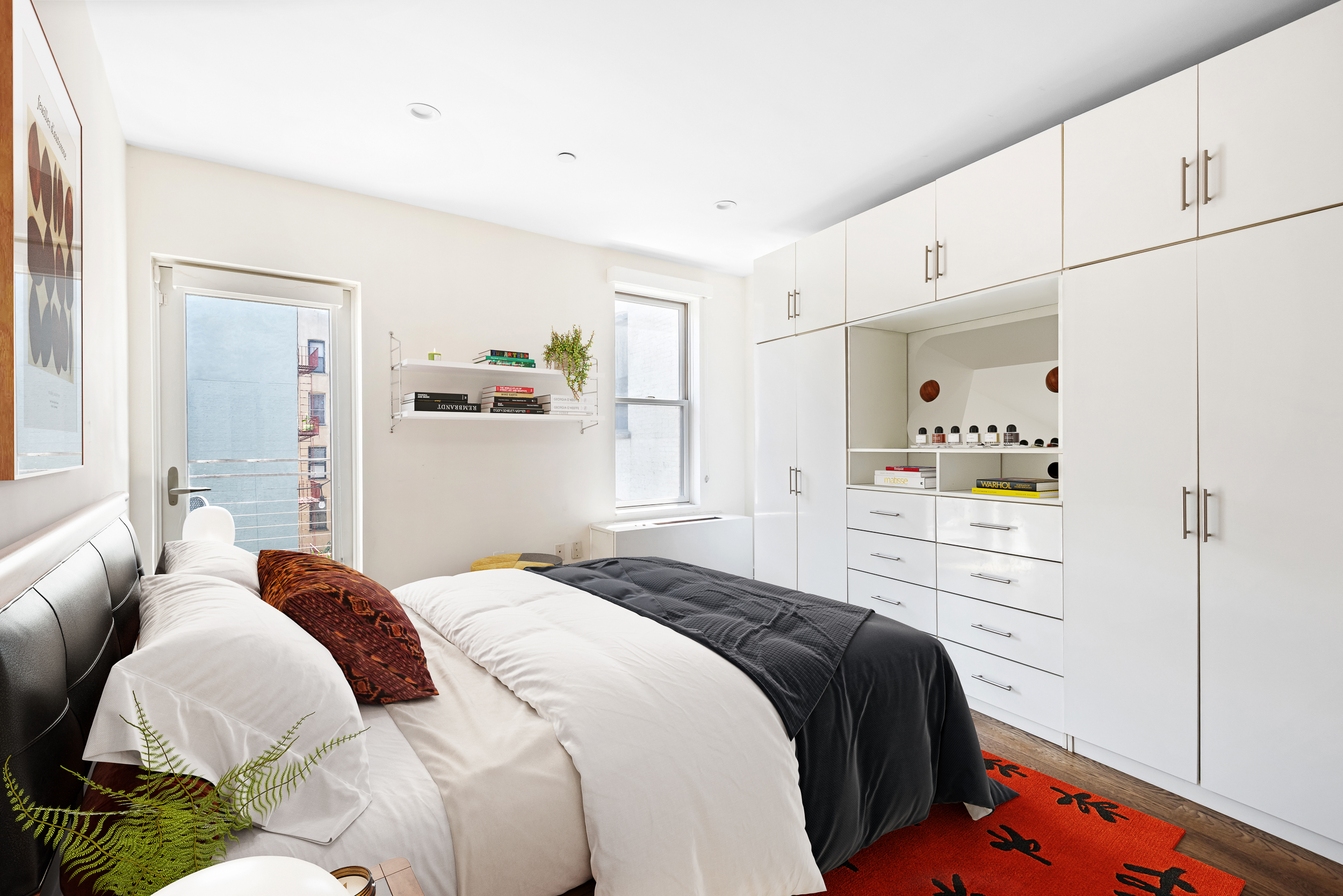 176 Mulberry Street, Unit 5 Manhattan, NY 10013 - Photo 8 of 12 a bedroom with a bed and a window