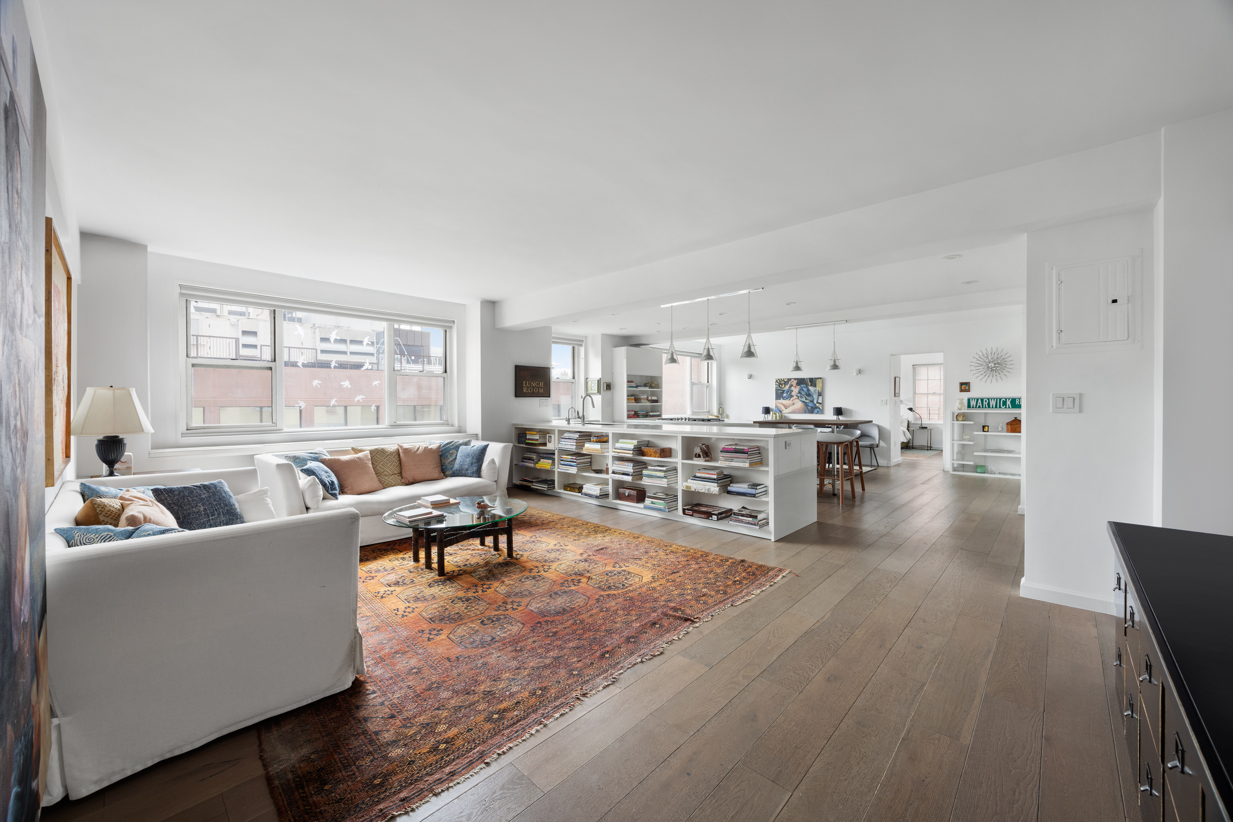 2 Horatio Street, Unit 8LNP Manhattan, NY 10014 - Photo 1 of 2 a living room with furniture and view of kitchen