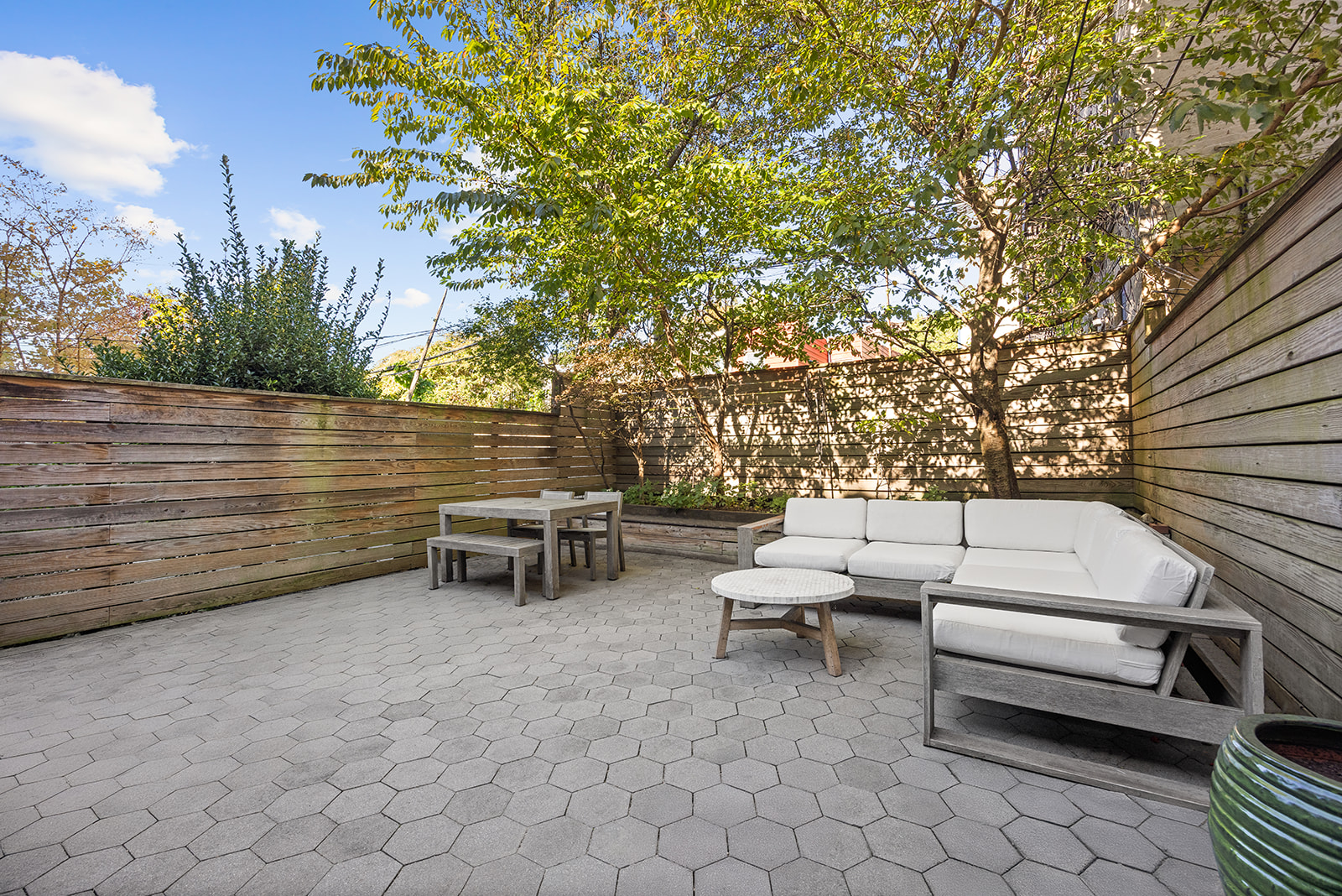 a view of a outdoor space with lounge chair and a fire pit