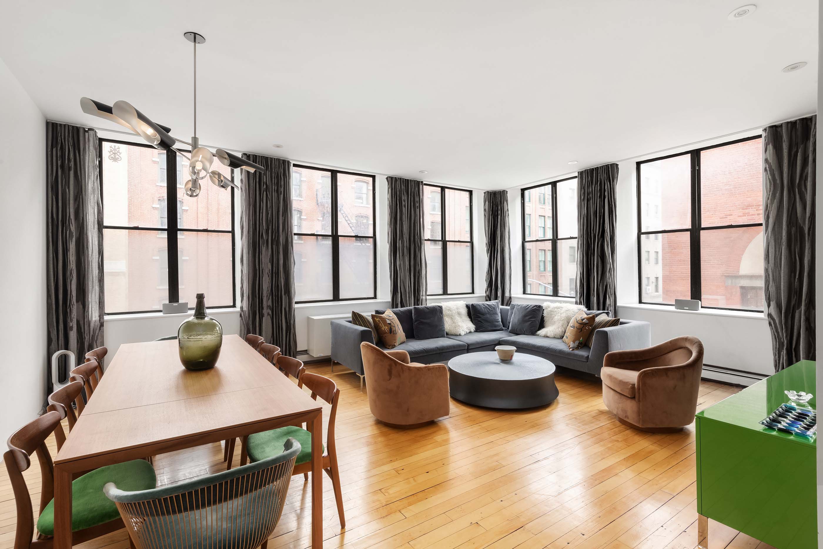57 Laight Street, Unit 3 Manhattan, NY 10013 - Photo 1 of 15 a living room with furniture and a window