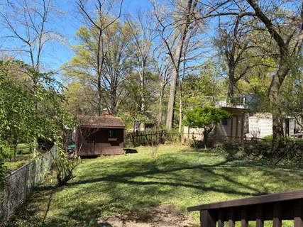 a view of house with yard