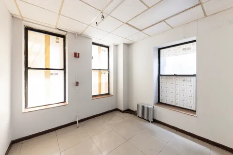 an empty room with windows