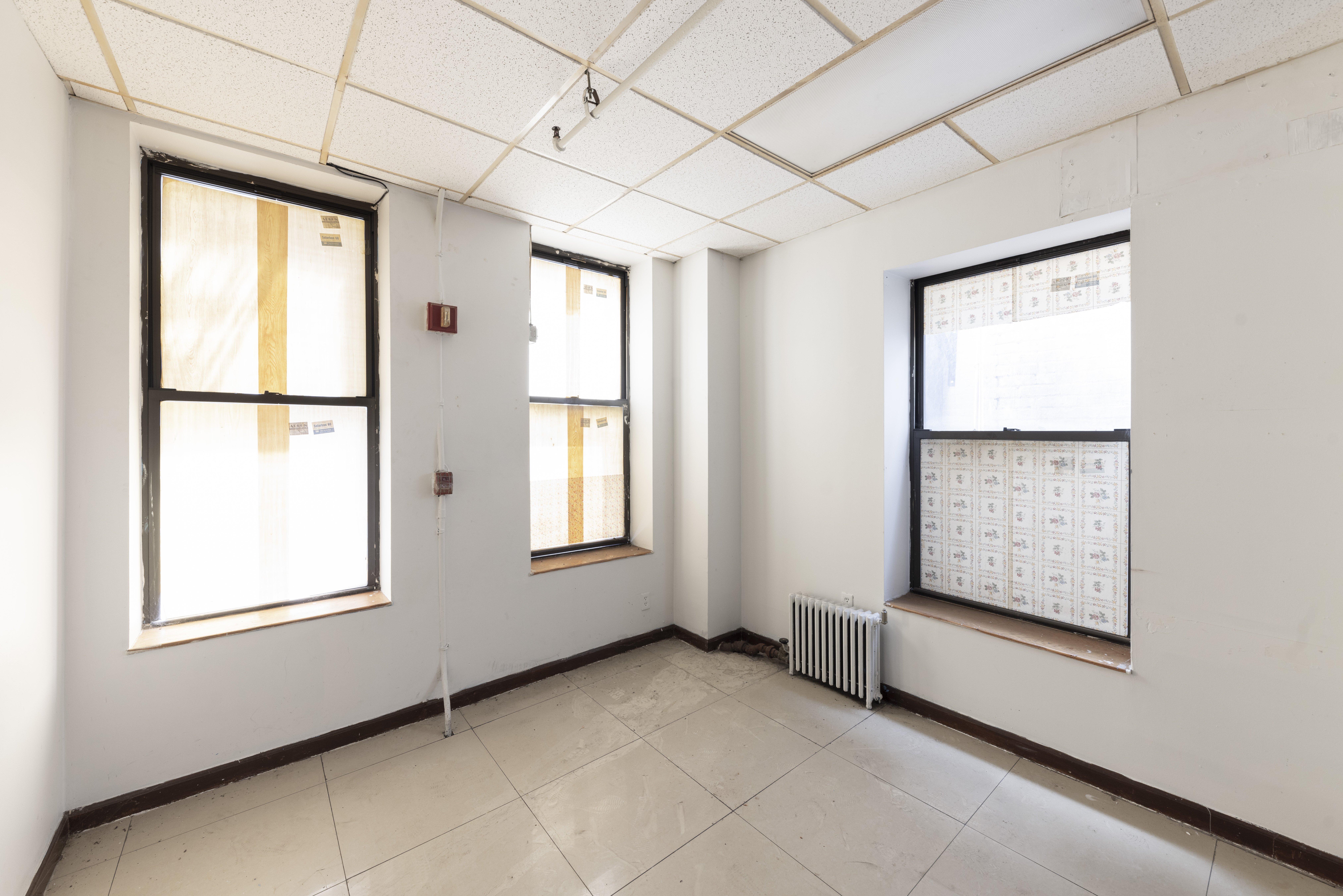 47 Division Street Manhattan, NY 10002 - Photo 3 of 11 an empty room with windows