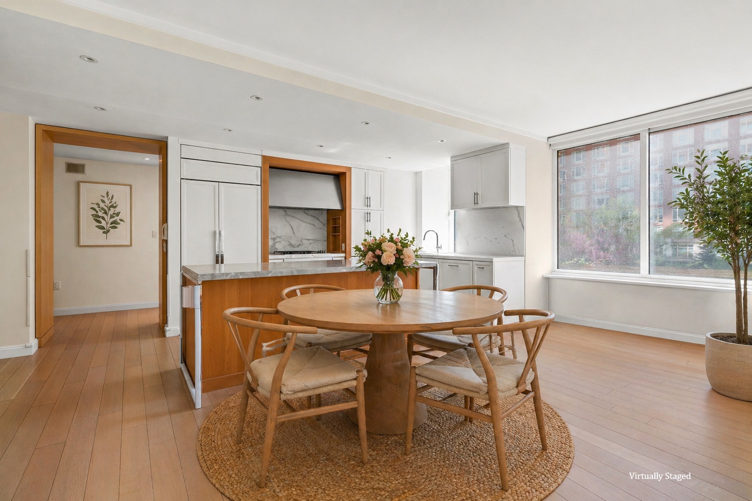 a view of a a dining room with furniture window and wooden floor