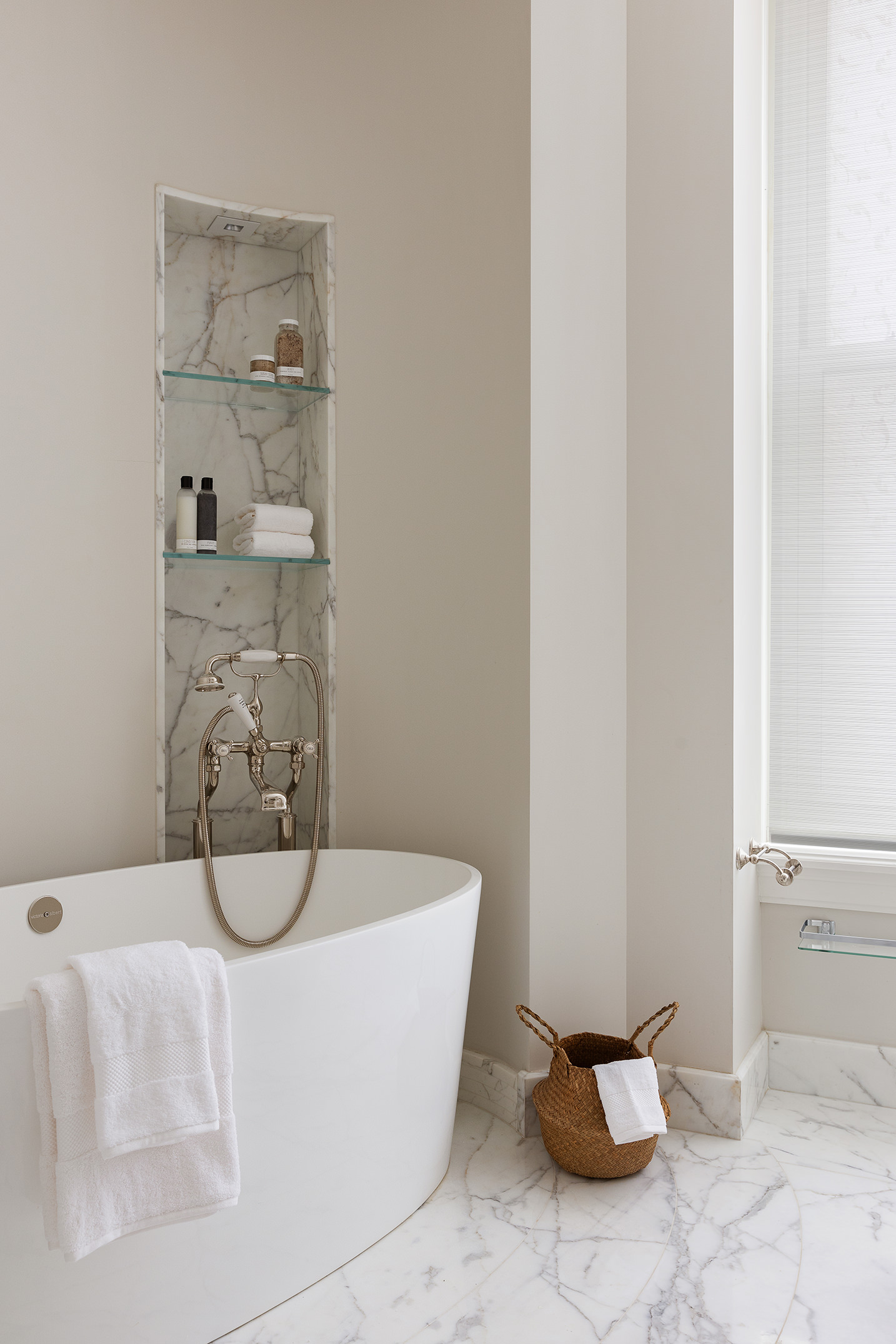 1 Central Park South, Unit 8010203 Manhattan, NY 10019 - Photo 17 of 45 a white tub sitting next to a bathroom sink