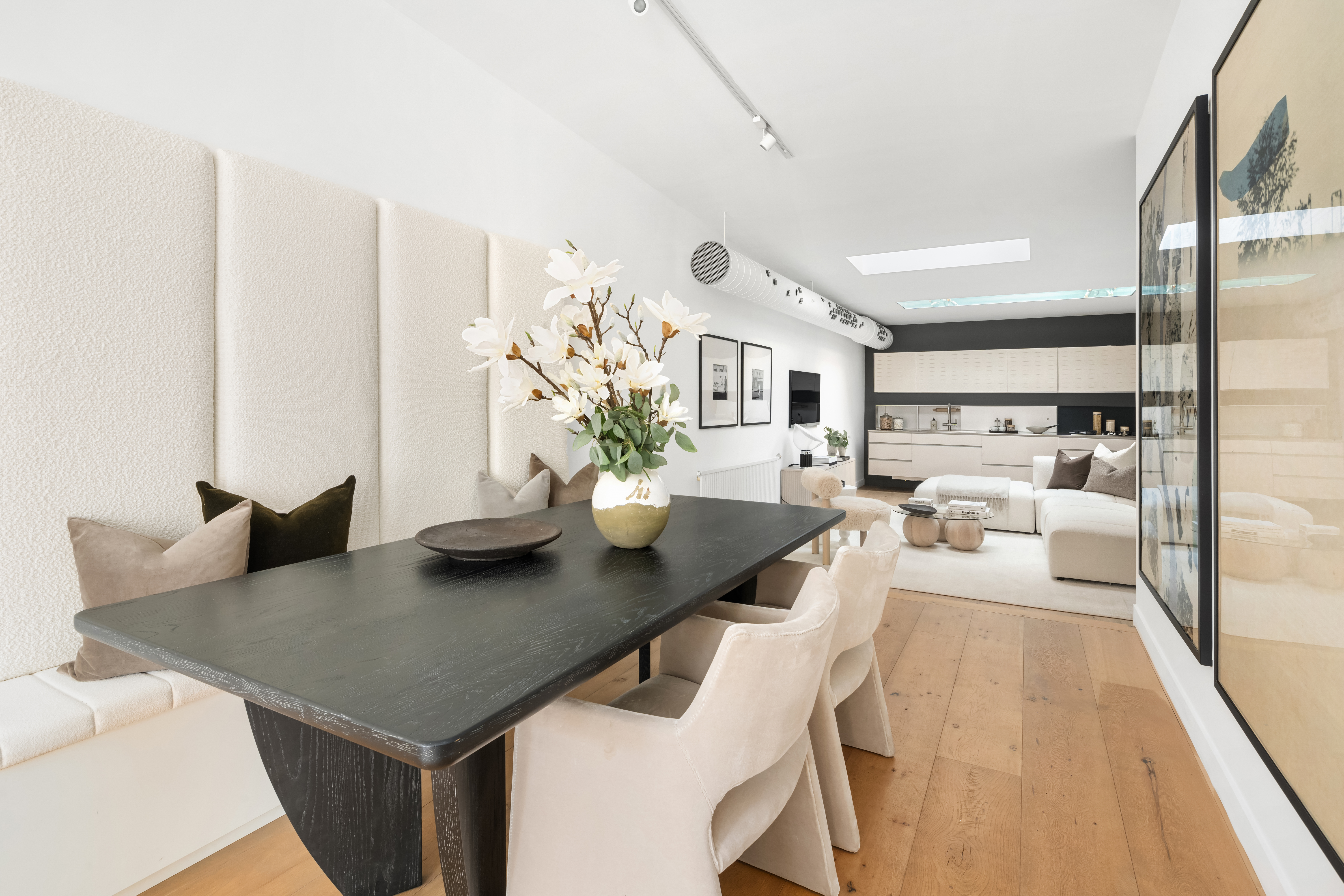 472 Greenwich Street, Unit PH Manhattan, NY 10013 - Photo 8 of 13 a view of a dining room with furniture and wooden floor