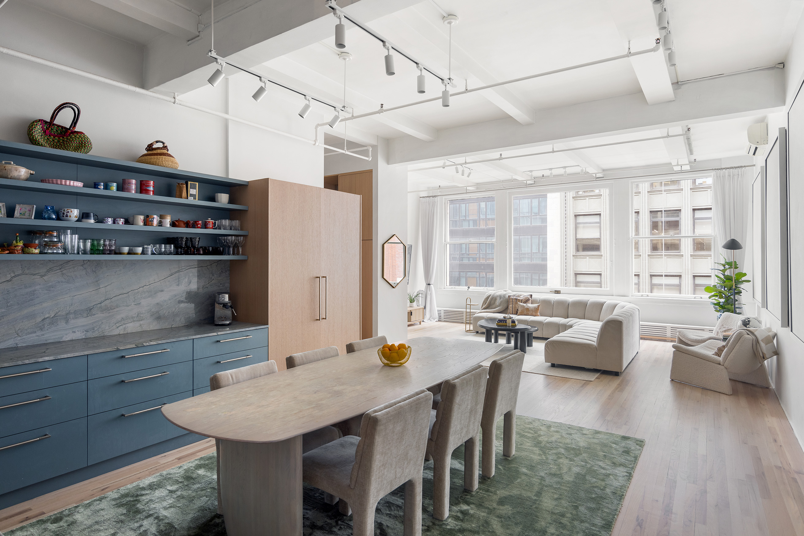 a large kitchen with a table and chairs