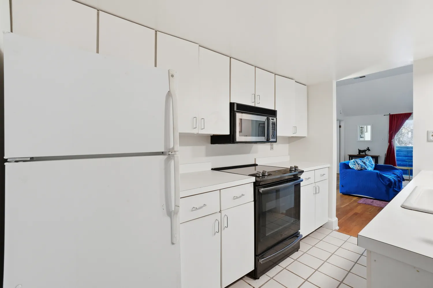 a kitchen with stainless steel appliances a refrigerator sink and cabinets