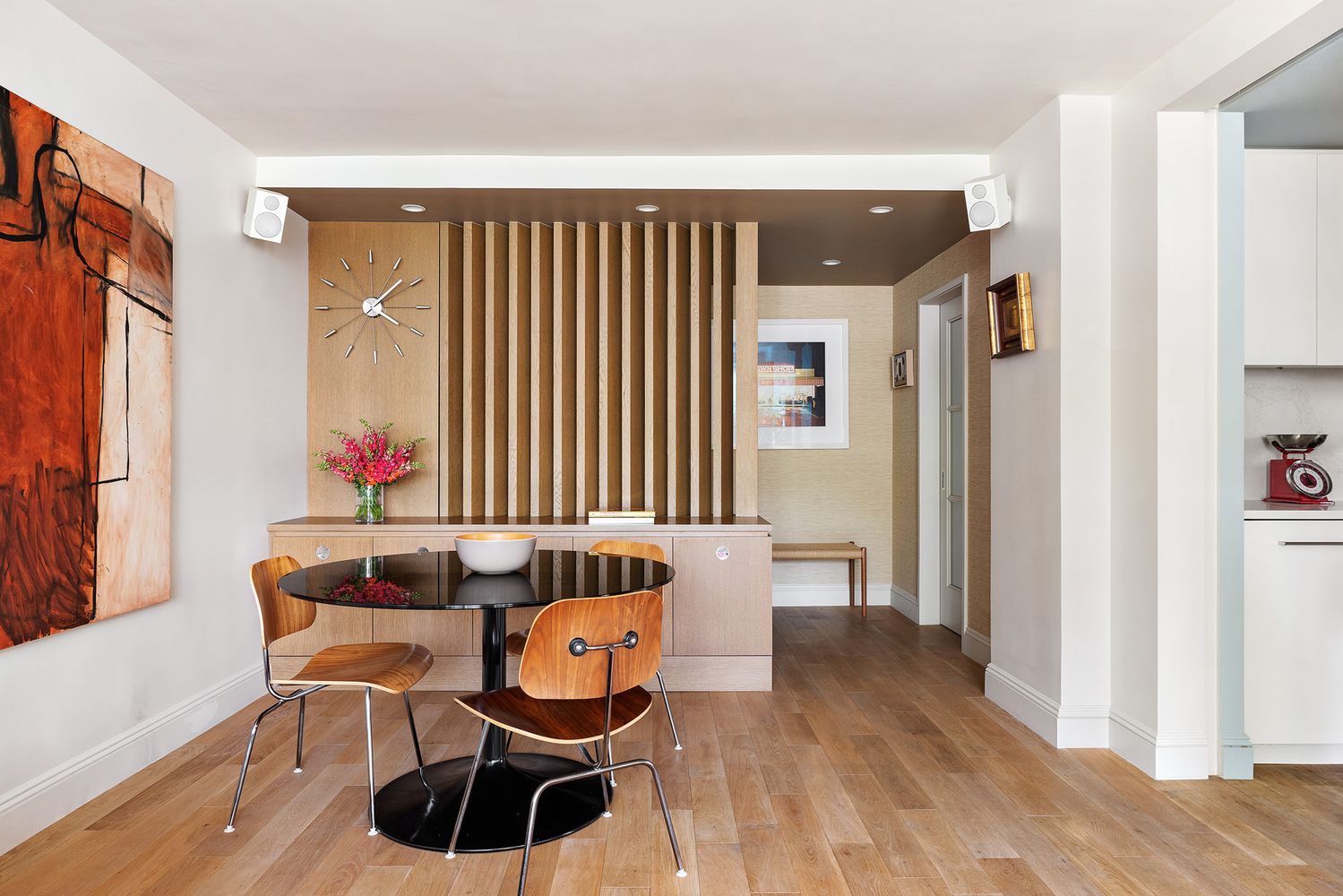 a dining room with furniture and wooden floor