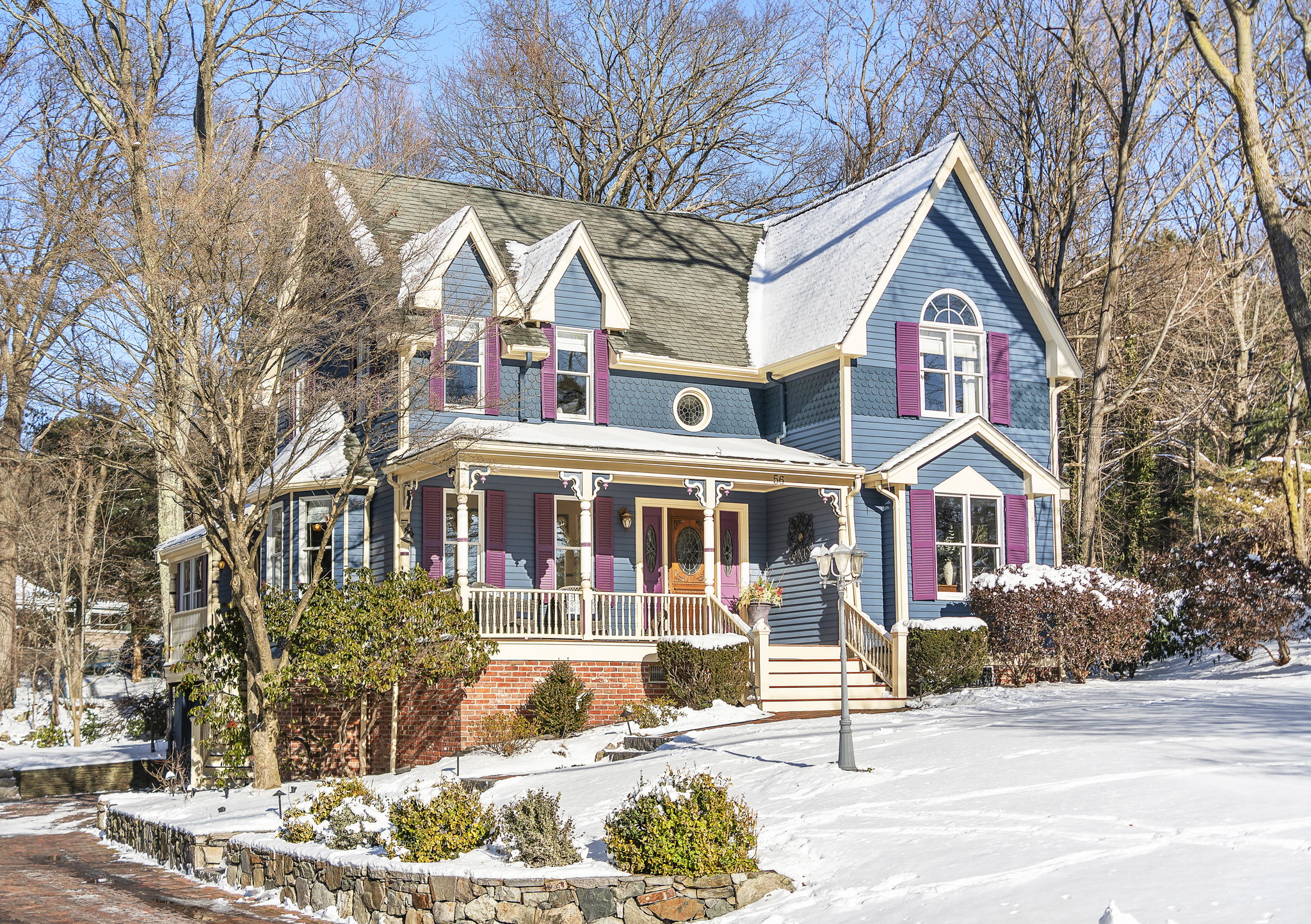 56 Jefferson Road Winchester, MA 01890 - Photo 3 of 26 a front view of a house with a yard