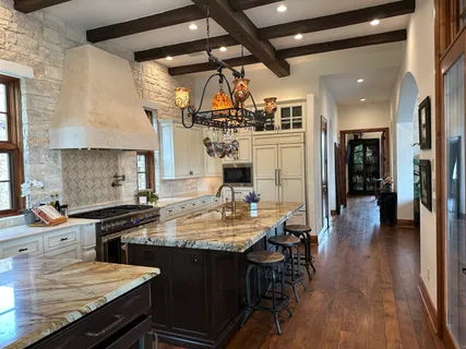 a view of a chairs and a table in the patio