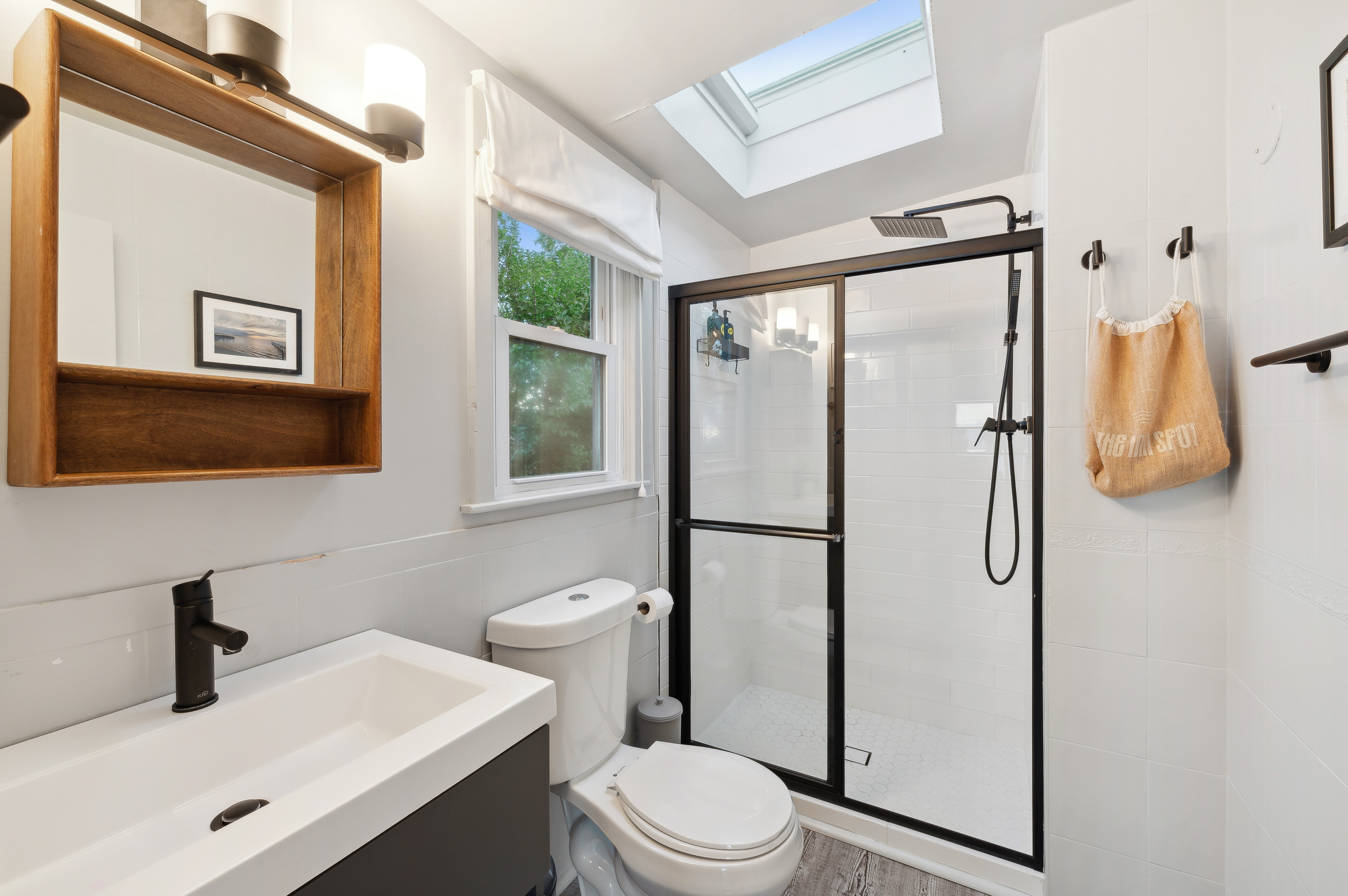 32 Lighthouse Road Hampton Bays, NY 11946 - Photo 46 of 51 a bathroom with a sink toilet and shower