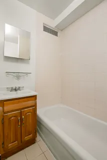 a bathroom with a bathtub and a sink