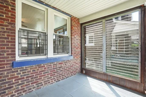 a view of a door and a window