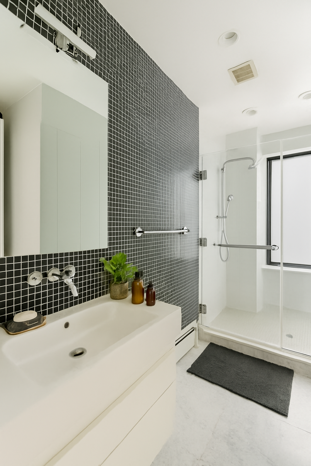 161 Grand Street, Unit PHB Manhattan, NY 10013 - Photo 9 of 11 a bathroom with a bathtub